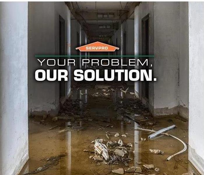photo of commercial water damage with SERVPRO logo and text "Your Problem, Our Solution"
